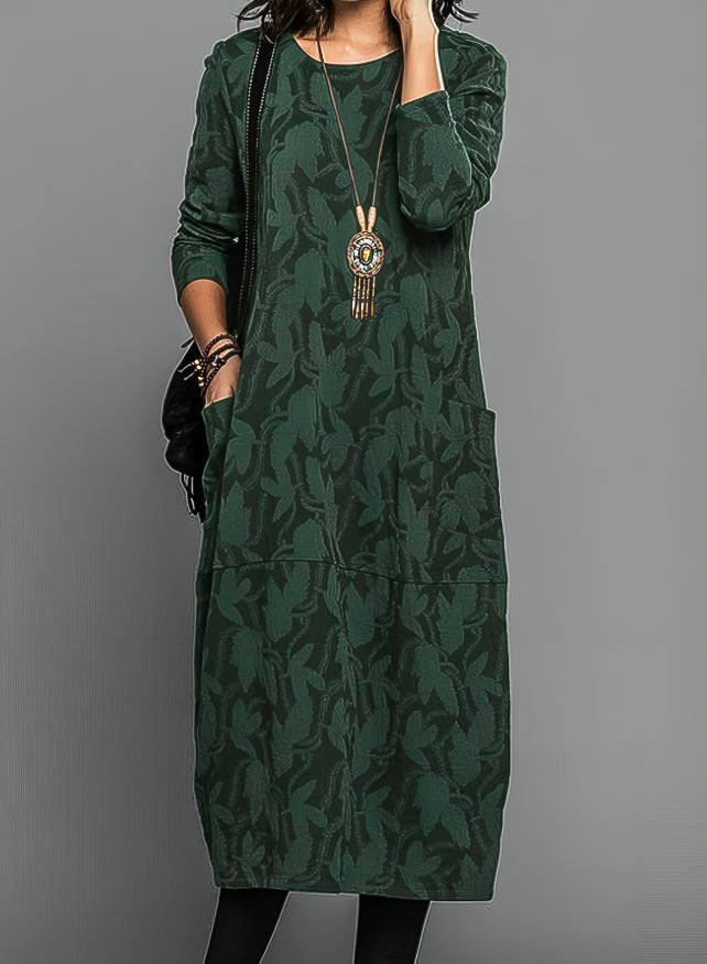 Women's casual midi dress with long sleeves, side pockets, and patterned hem detail for everyday elegant comfort