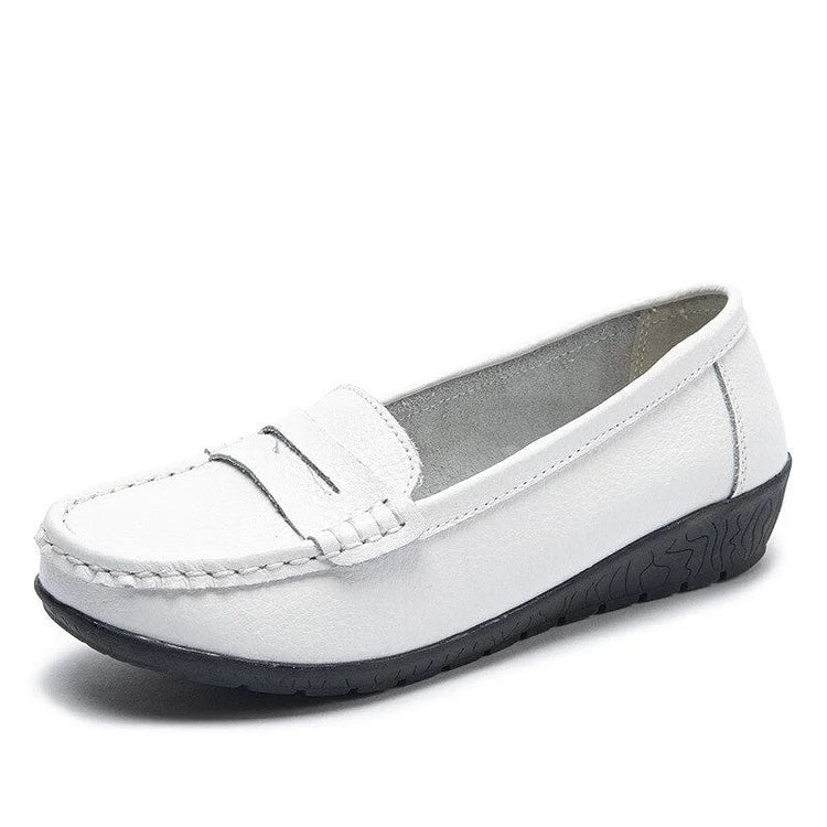 Women's black genuine leather slip-on loafers with cushioned PU lining and flexible rubber sole