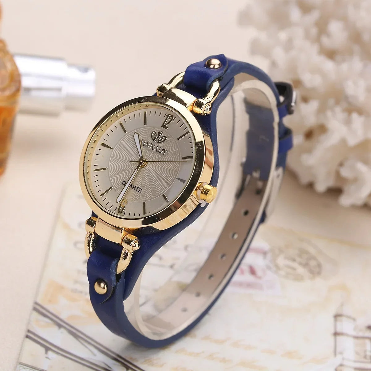 Sophie minimalist quartz watch gold-tone steel case vegan leather strap engraved dial women