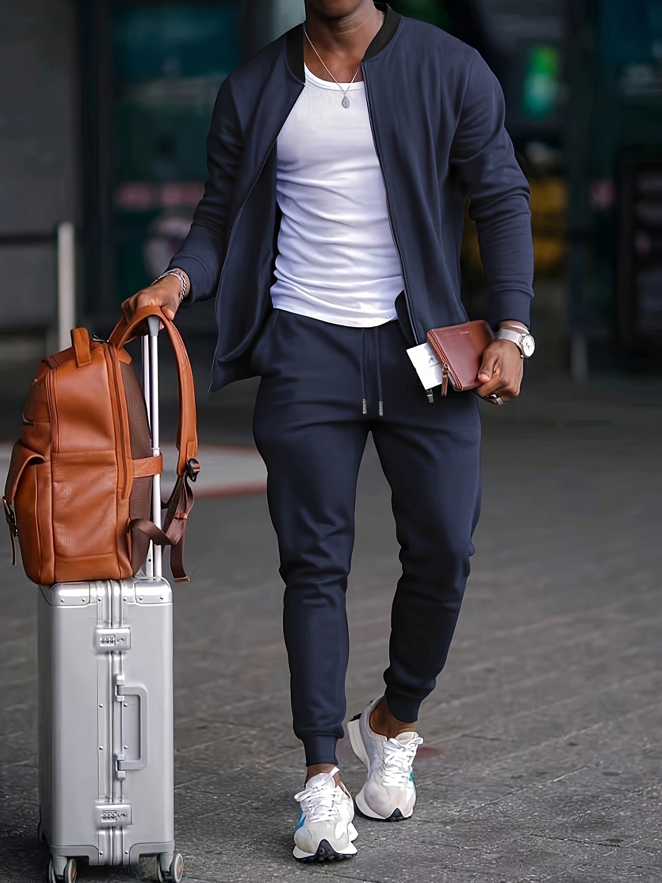 Men's gray tapered tracksuit set with zip-up jacket and joggers, modern slim casual travel fit