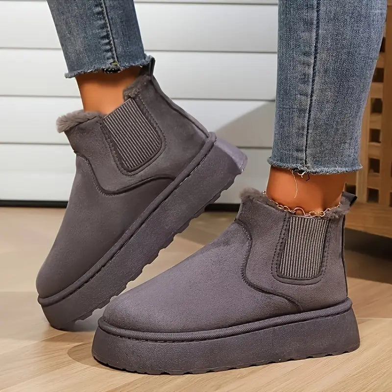 Women's black plush platform boots with faux fur lining, chunky sole, slip-on winter style
