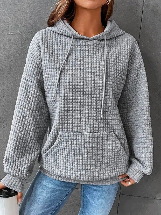 Women's loose fit hoodie with kangaroo pocket in soft textured fabric for casual everyday comfort