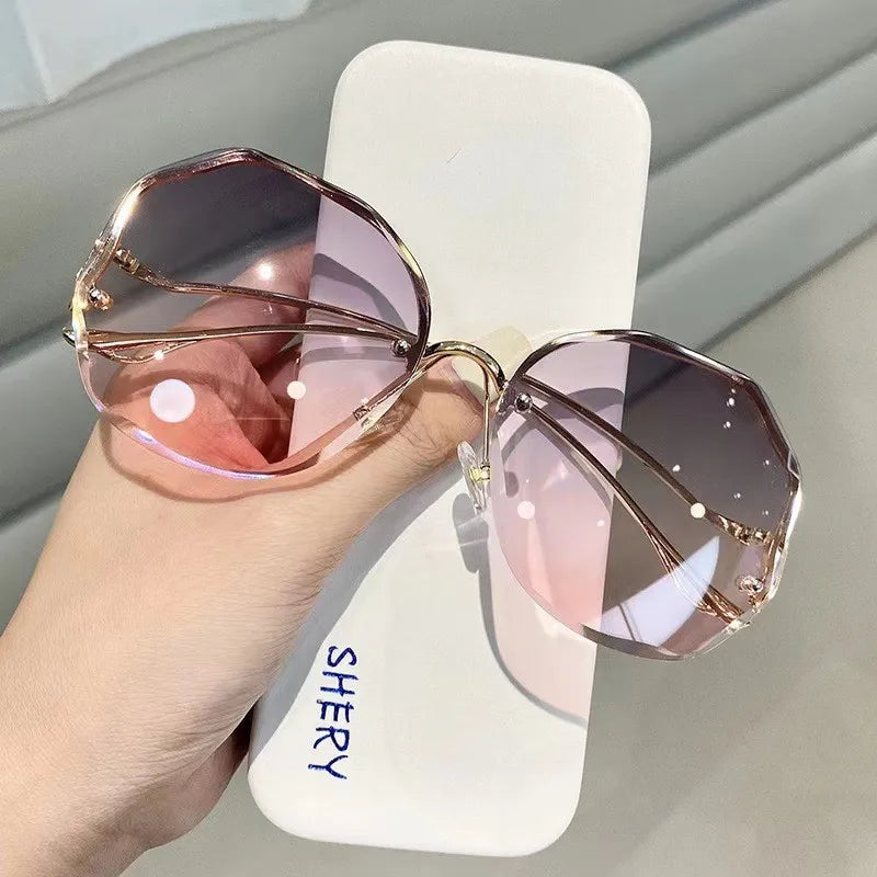 Women's rimless butterfly sunglasses bold petal-cut gradient UV400 lenses gold-tone temples