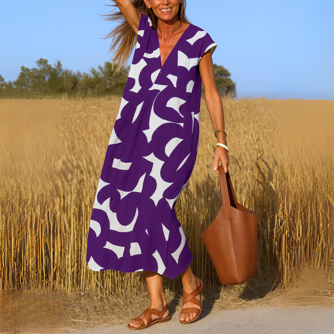 Women's abstract print midi dress with V-neck, sleeveless cut, shaping pleats, breathable fabric