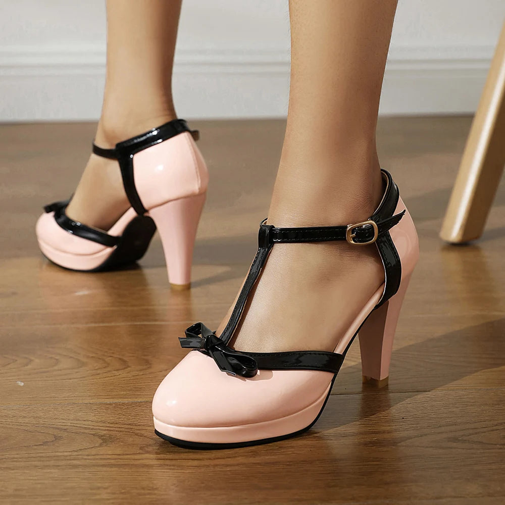 Madeleine women's T-strap block heels with bow accent, rounded toe, premium faux leather, adjustable buckle