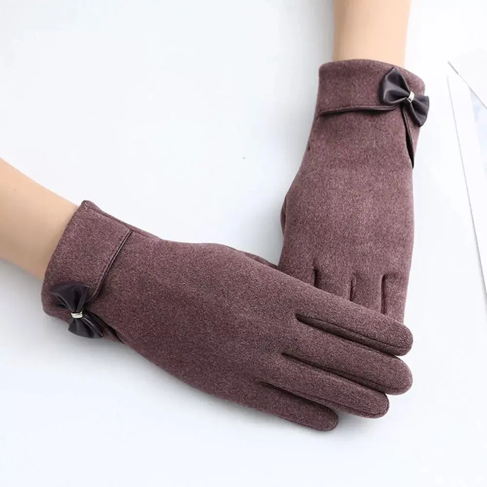 Women's black winter touchscreen gloves with elegant bow detail and split-finger design for cold weather