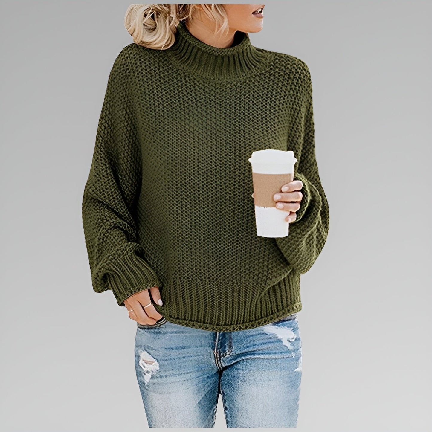 Women's oversized chunky knit sweater in neutral tones, relaxed fit with textured cozy warmth