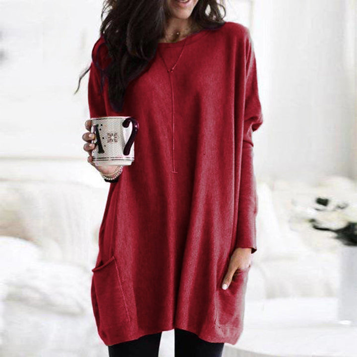 Women's long winter tunic with round neckline, cozy casual lounge fit, and functional front pockets