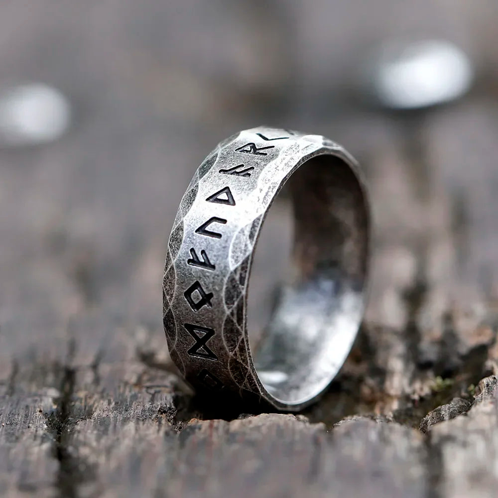 Unisex 8mm stainless steel band ring with deep-carved ancient runes and stone-hammered finish