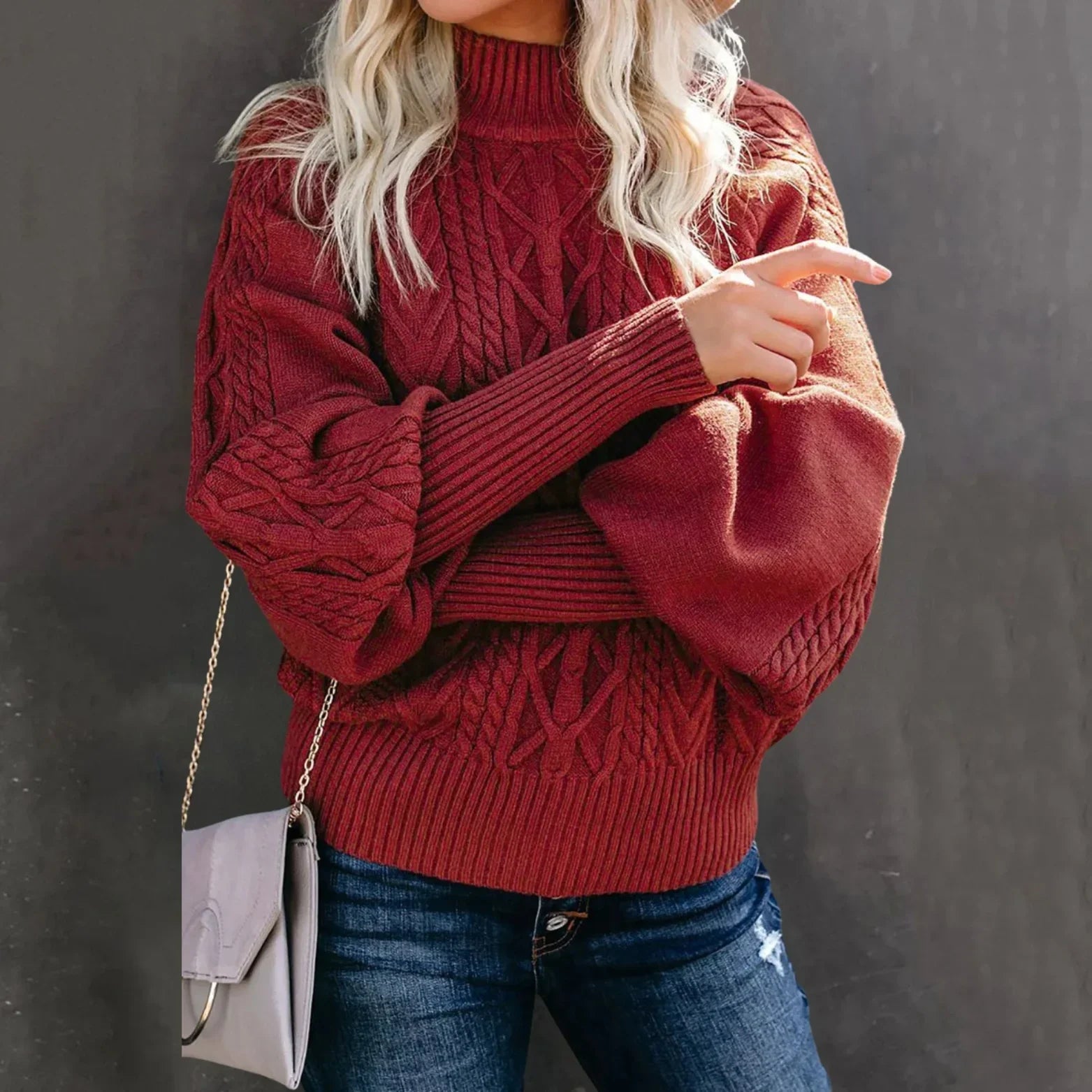 Women's oversized cream cable knit sweater with high neck relaxed fit and rich textured pattern