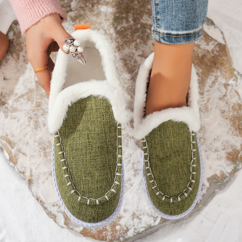 Suede slip-on loafers with warm fur lining and snow-grip outsole for winter days