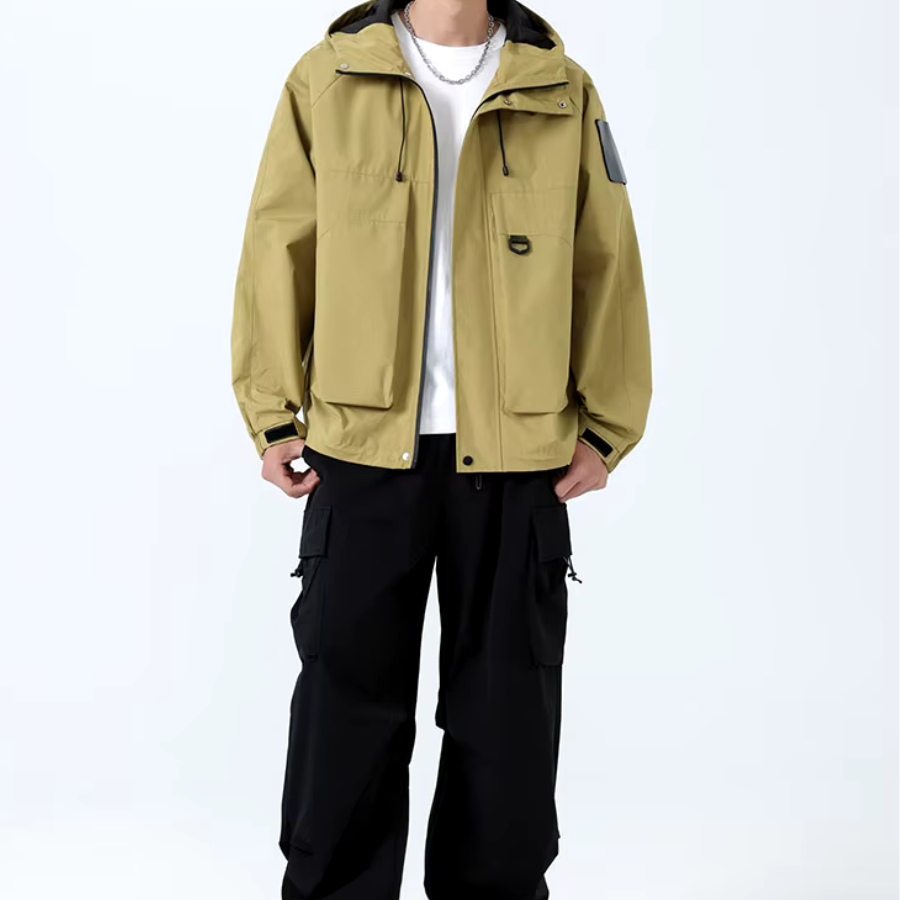 Men's black oversized hooded windproof jacket with utility pockets and adjustable hood