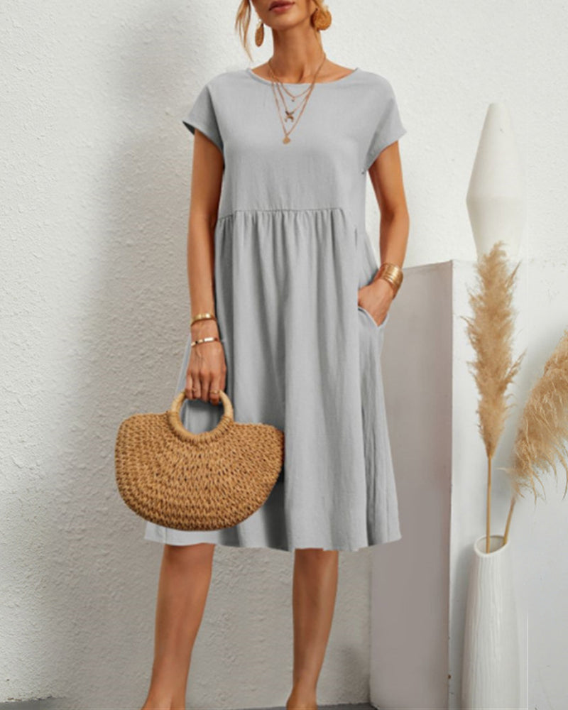 Women's round neck midi dress with pockets, versatile everyday style in polished silhouette