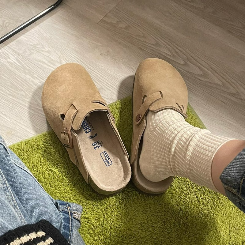 Women's beige suede closed-toe slides with gold buckle detail, lightweight slip-on style for everyday comfort