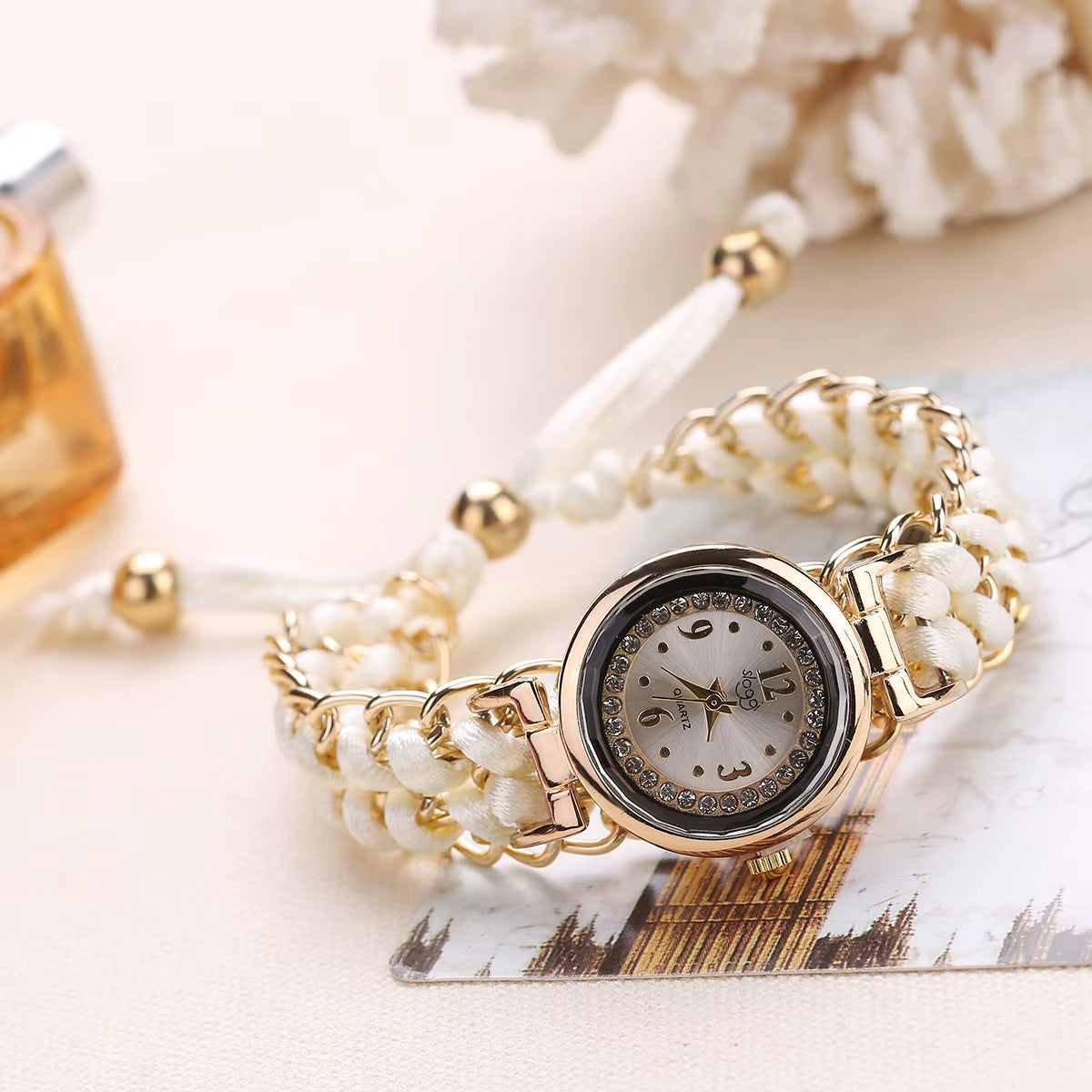 Athena women's gold bezel quartz watch crystal-studded dial with intricately woven braided cord band