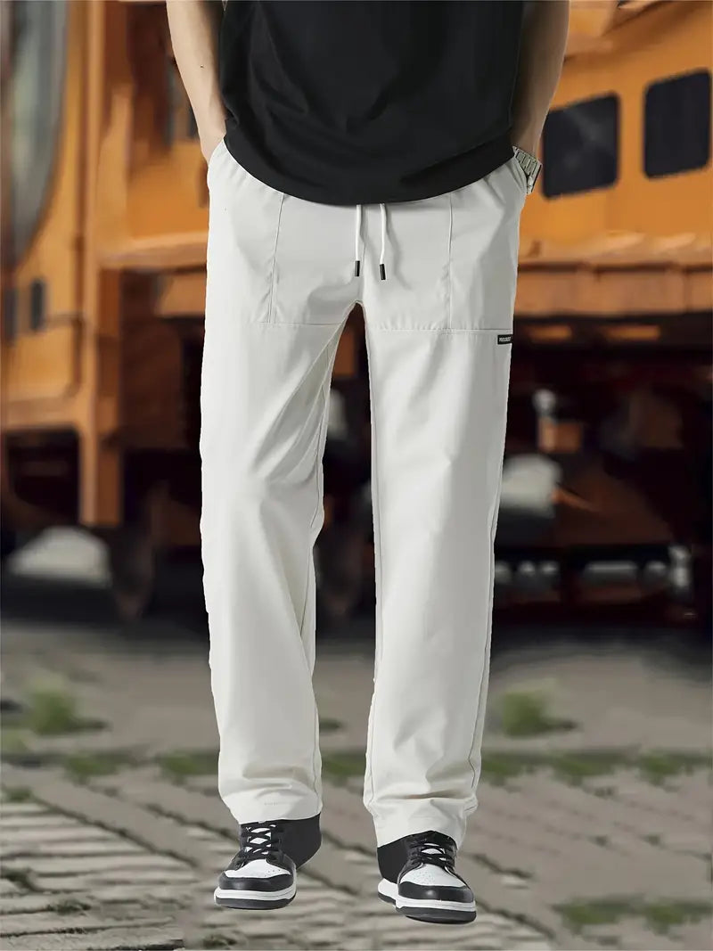 Men's relaxed fit casual pants with adjustable waistline, generous hip and thigh cut for all-day comfort