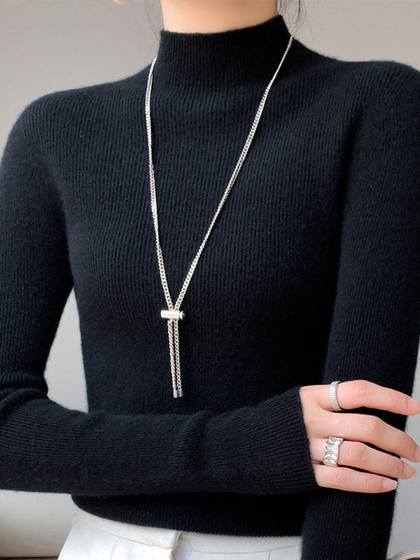 Women's ivory ribbed knit turtleneck sweater with flattering slim fit and high neck detail