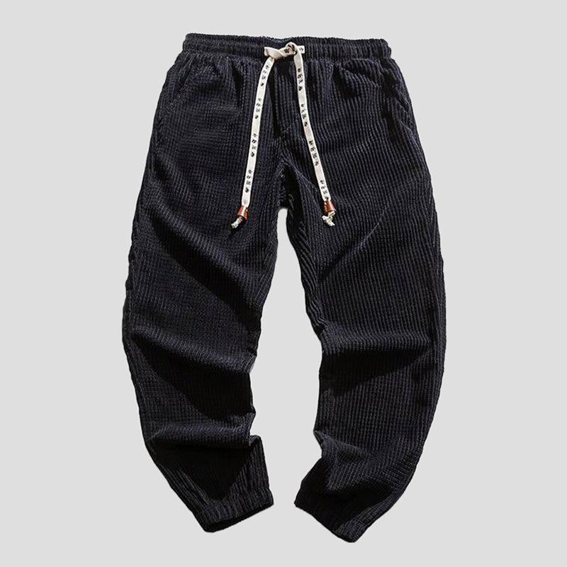 Black urban relaxed-fit pants with adjustable drawcord waistband for versatile everyday comfort