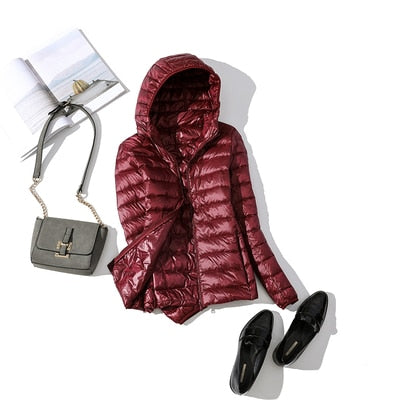 Women's short quilted winter jacket zip-front warm casual coat sleek modern silhouette