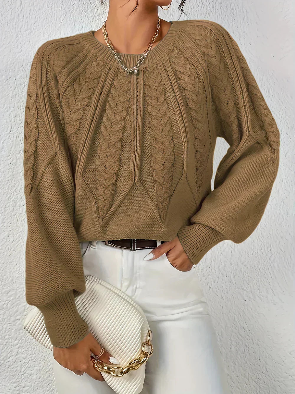 Women's relaxed-fit cable knit crocheted sweater with textured crochet-inspired pattern for cool weather