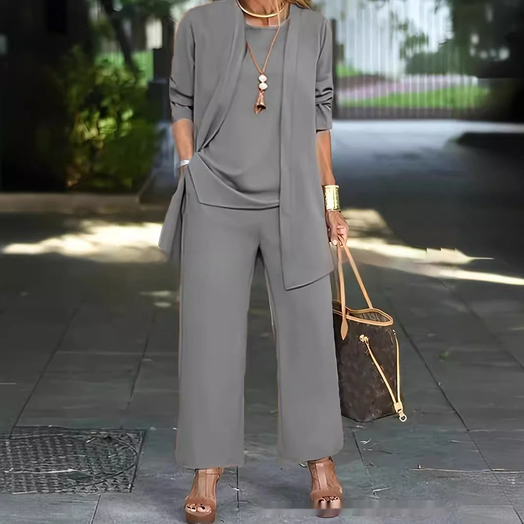 Women's elegant white sleeveless top, long jacket & wide-leg pantsuit set with round neckline