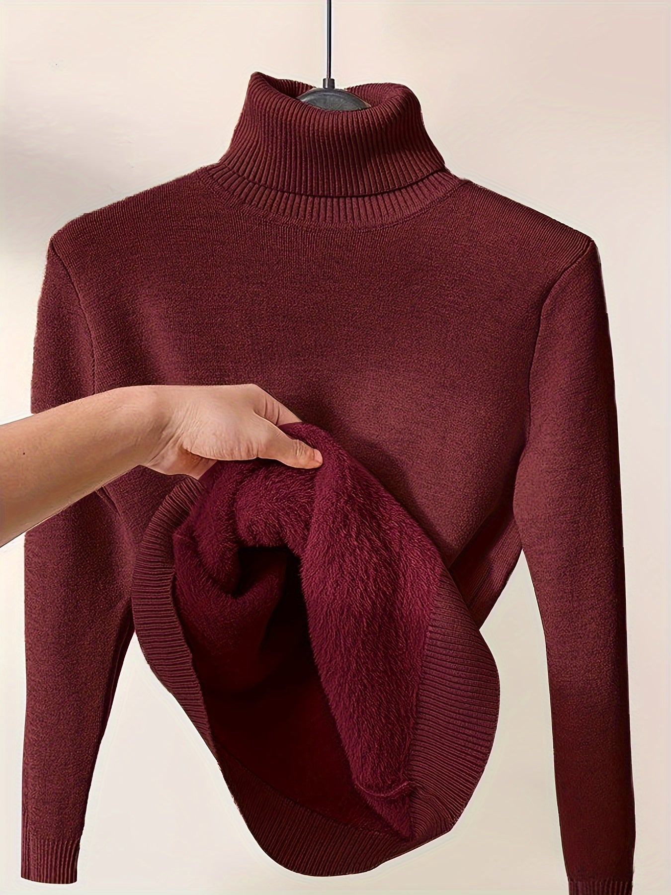 Women's fleece-lined turtleneck knit sweater, minimalist smooth exterior for cold-weather layering
