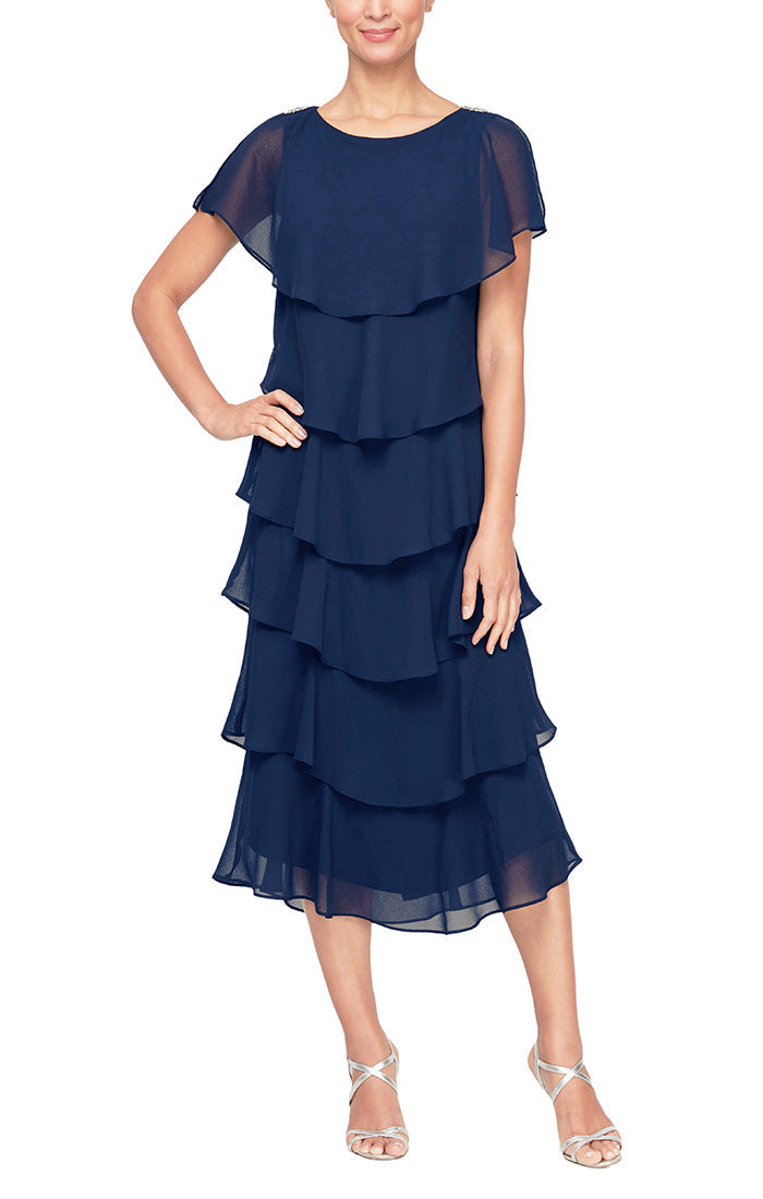 Elegant navy tea-length caplet dress with flutter sleeves and tiered skirt, flattering mother of the bride style