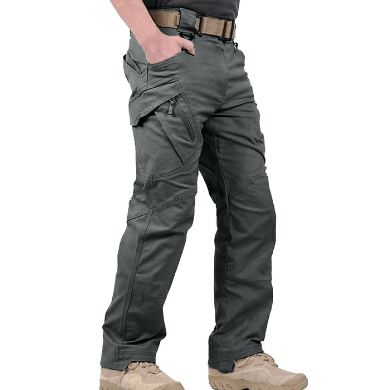 Men's black tactical waterproof pants with reinforced stitching and multiple utility pockets