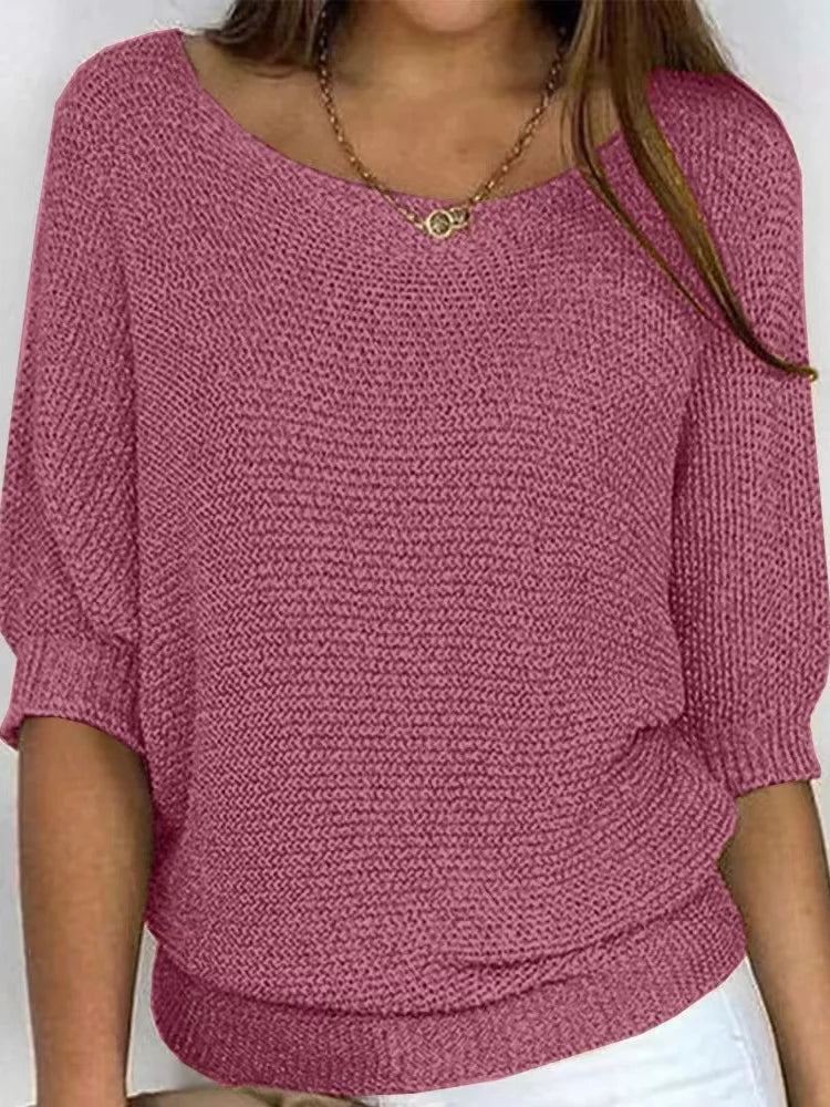 Women's cozy loose-fit knitted sweater with elbow sleeves and boat neckline for casual layering