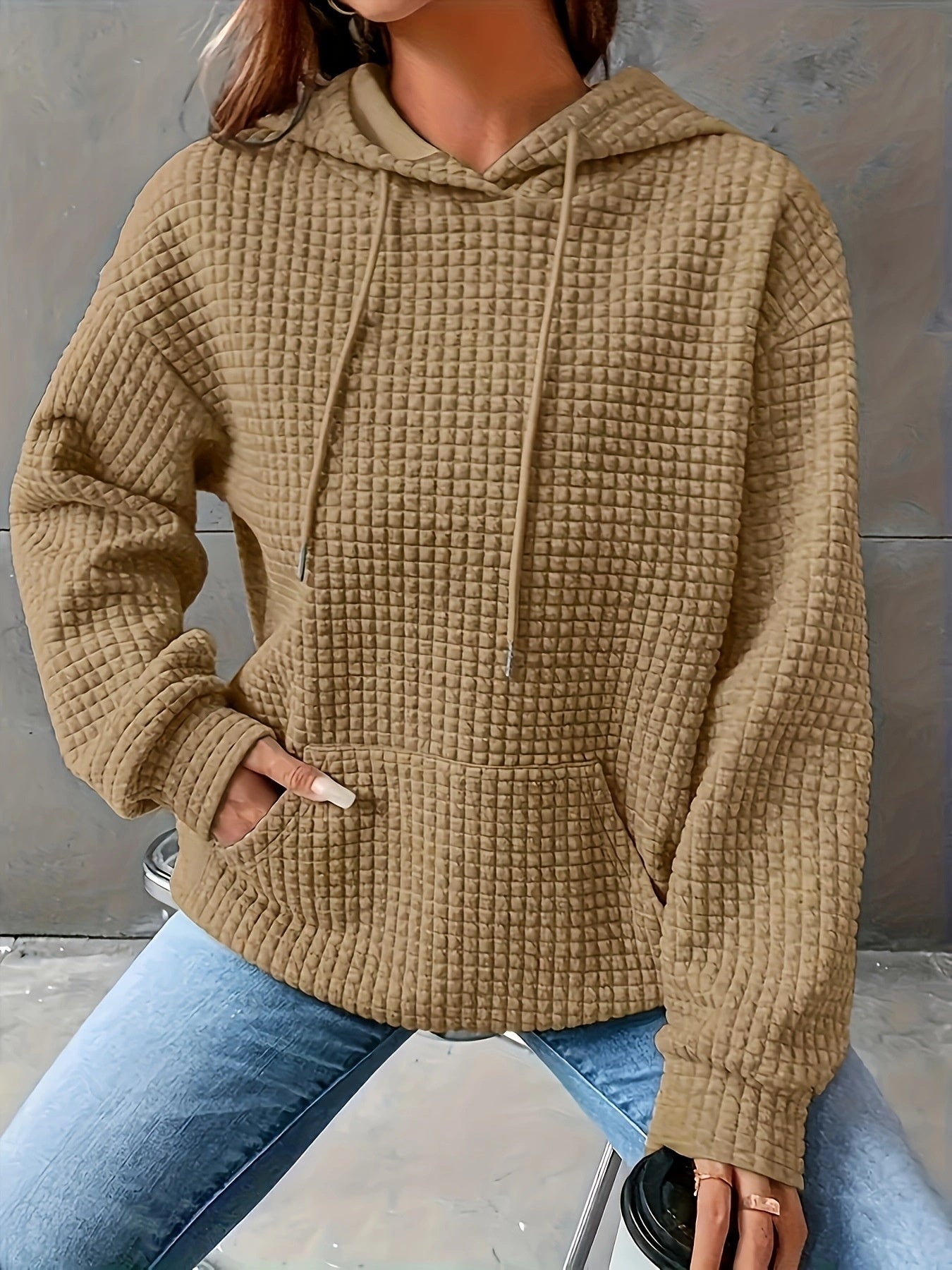 Women's loose-fit casual hoodie with kangaroo pocket in soft textured fabric for everyday comfort