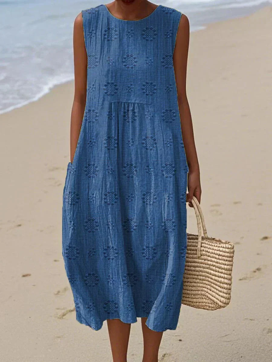 Women's sleeveless textured midi dress with gathered waist, circular print motifs, lightweight breezy summer style