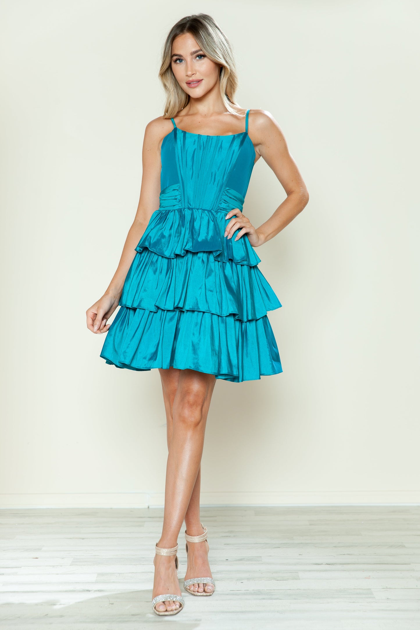Short taffeta A-line homecoming dress with tiered skirt, boned bodice, and spaghetti straps for teens