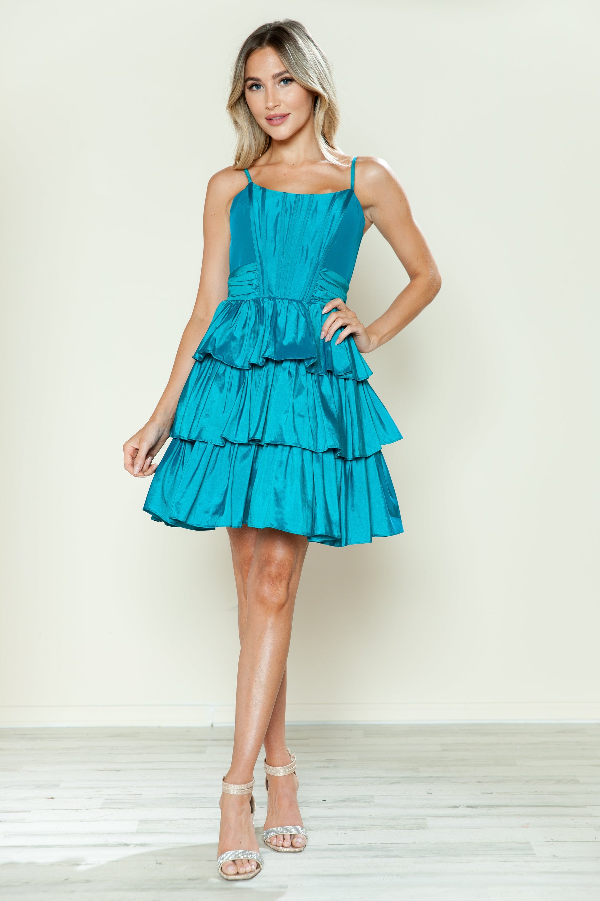 Short taffeta A-line homecoming dress with tiered skirt, boned bodice, and spaghetti straps for teens