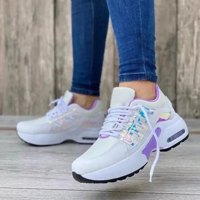 White lightweight women's walking sneakers with breathable mesh upper and cushioned sole for all-day comfort