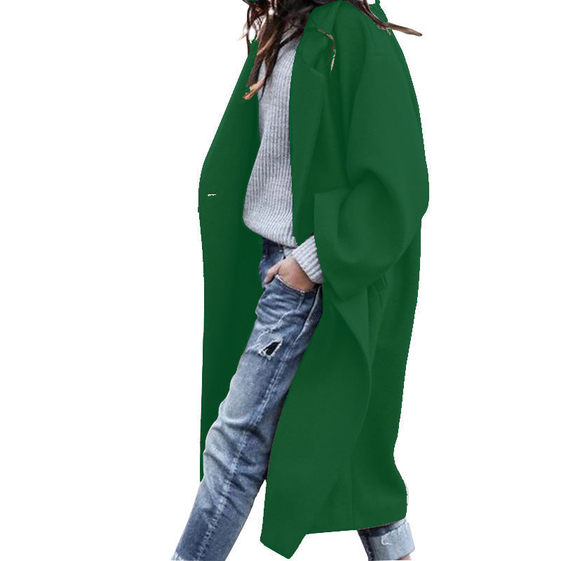 Women's elegant long polyester coat with lapel collar, single-breasted closure, and side pockets for winter