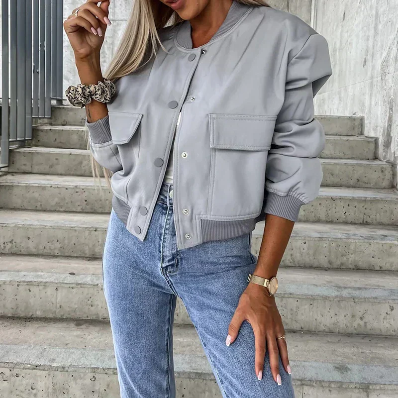 Women's short bomber jacket with snap button closure and flap pockets, casual street style