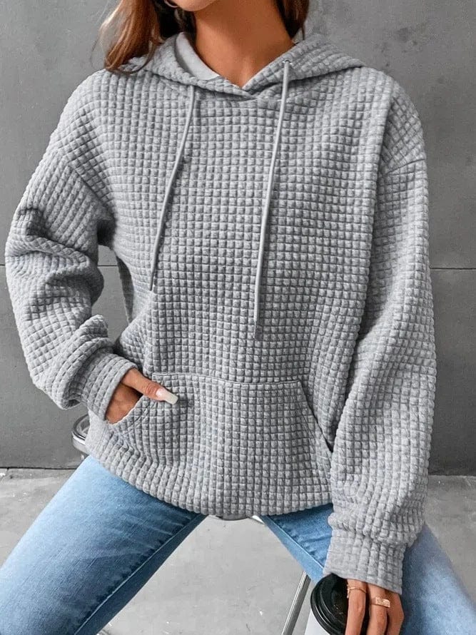 Women's black quilted hoodie relaxed fit with drawstring hood and kangaroo pocket ribbed trim
