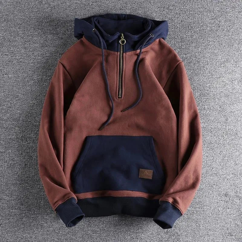 Dual-tone quarter-zip hoodie with ring-pull zipper, adjustable hood, kangaroo pocket for urban style