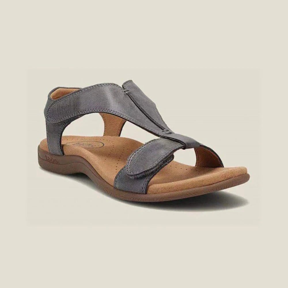 Beige adjustable strap sandals with contoured footbed and open-toe design for all-day comfort