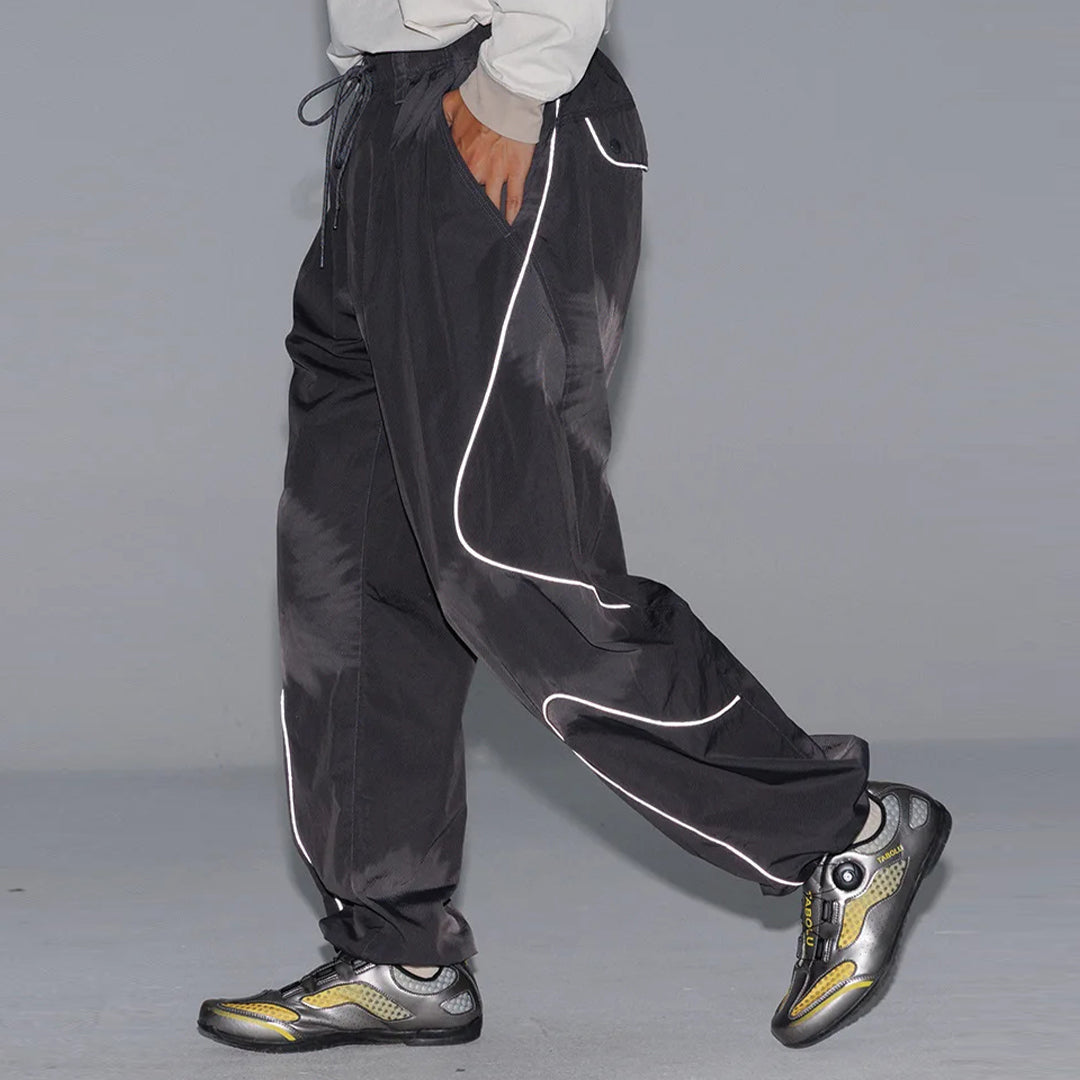 Black quick-dry nylon running trousers with curved reflective stripes and drawstring waist