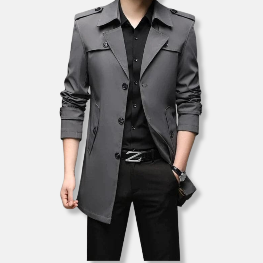 Men's slim fit thigh-length trench coat with button front, epaulets, and storm flaps