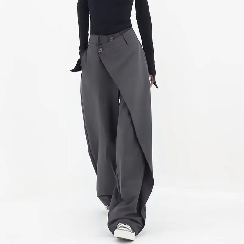 Black wide-leg wrap pants asymmetric drape architectural tailoring bold silhouette for women