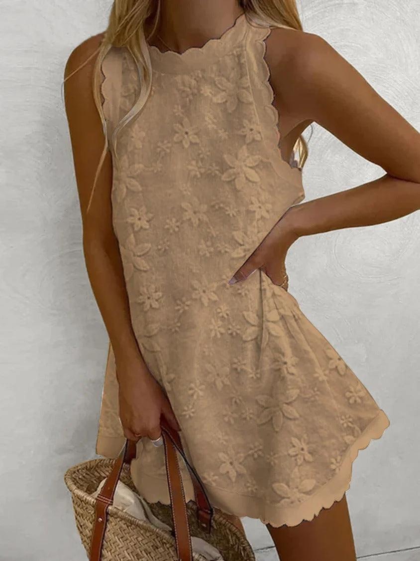 White embroidered lace sleeveless mini dress with relaxed silhouette and floral detail