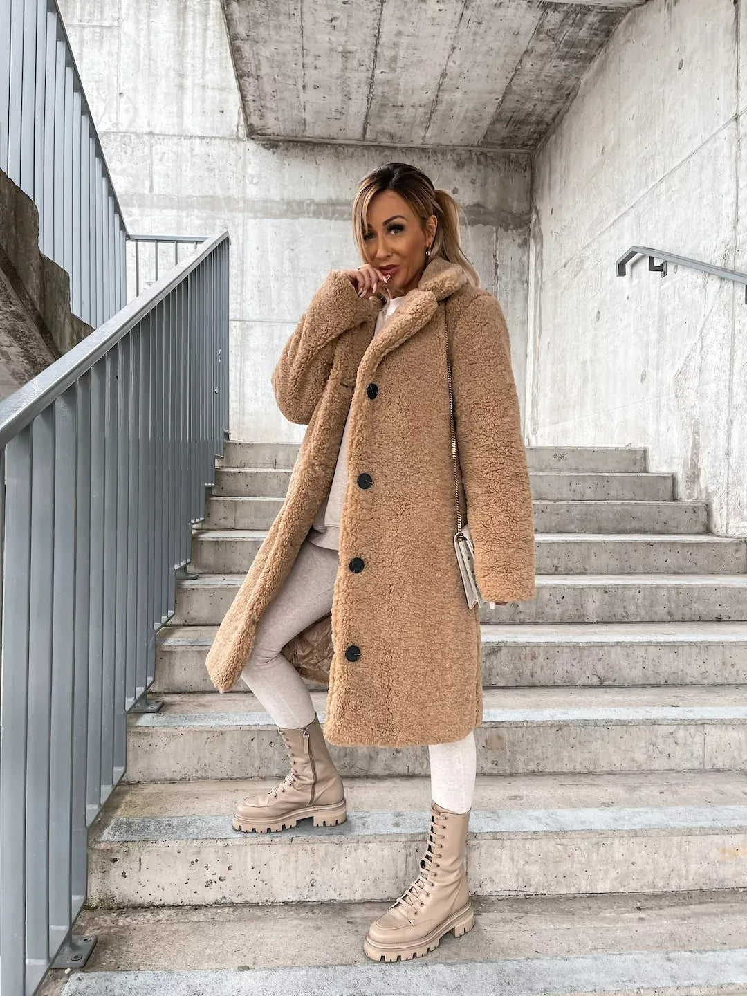 Women's plush trench coat in elegant neutral tone, cozy oversized silhouette with premium soft fabric