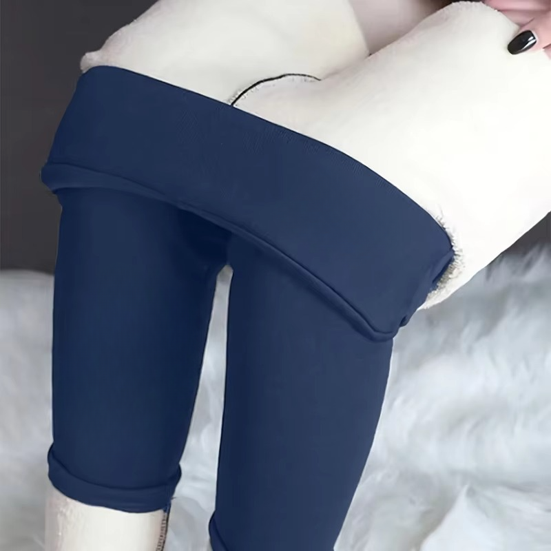 Women's high-waisted black sherpa fleece-lined thermal leggings with tummy control for winter running