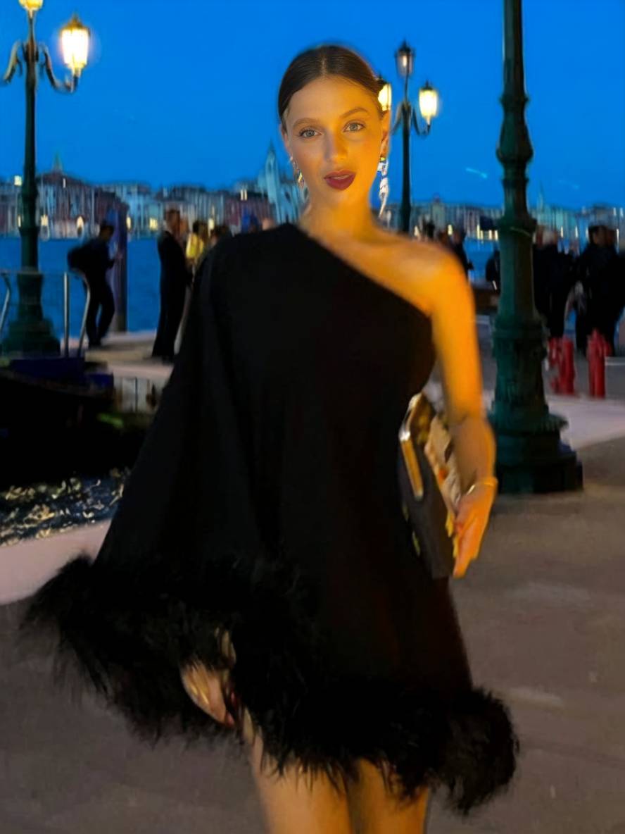 Élodie black one-shoulder cape sleeve short A-line cocktail dress with asymmetric silhouette