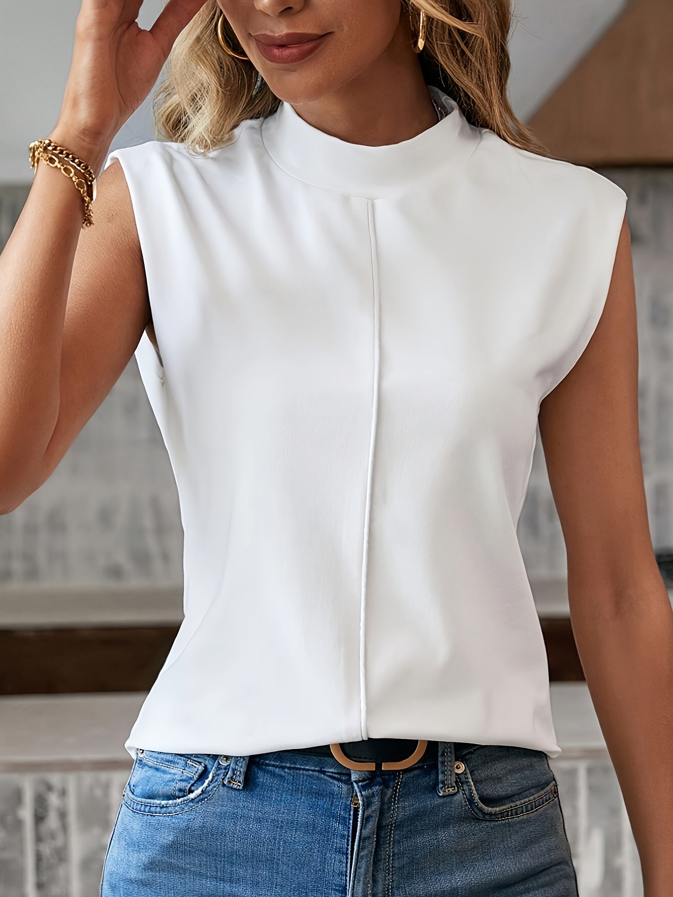 White sleeveless women's blouse high collar minimalist cut with subtle front stitching detail
