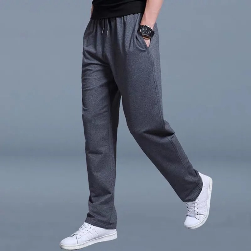 Unisex relaxed straight-leg jogger pants in neutral tones with elastic waistband and adjustable drawstring