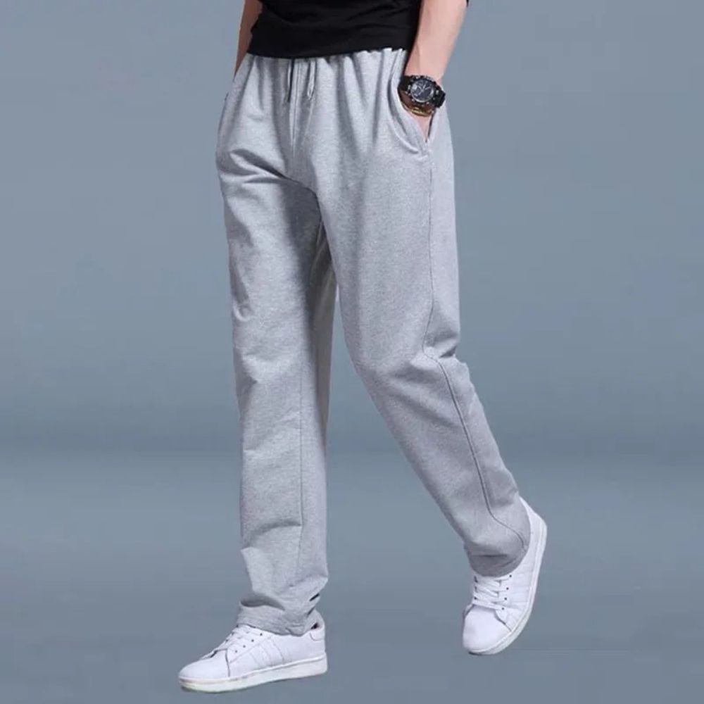 Unisex relaxed straight-leg jogger pants in neutral tones with elastic waistband and adjustable drawstring