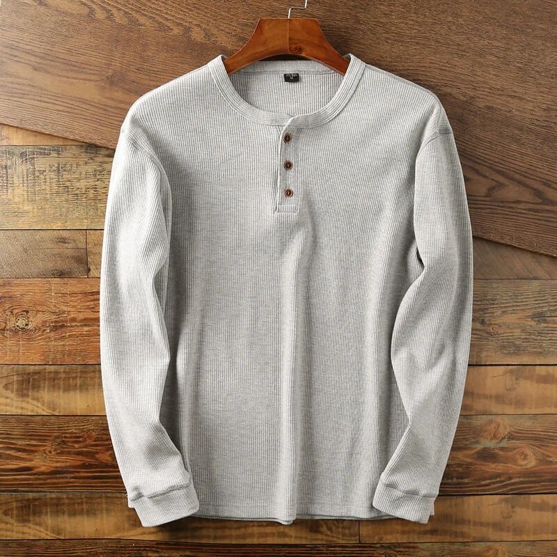 Men's classic long sleeve shirt in neutral tone, tailored fit with adjustable button collar closure